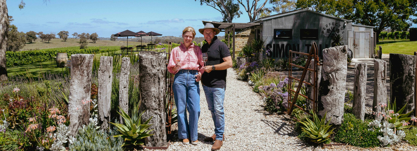 A couple enjoying Simon Tolley Wines outside